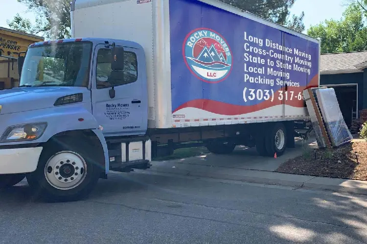 Rocky Movers truck parked at a Denver home during a full packing service—the start of the step-by-step process.