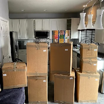 Assorted moving boxes packed by Rocky Movers team for a long distance move