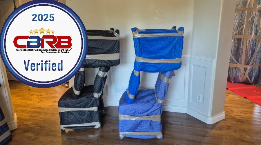 ocky Movers CBRB Verified 2025 badge with furniture wrapped in moving blankets inside a Lakewood, CO home, showing trusted protection.